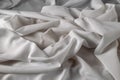 White fine chiffon fabric with a woven texture. Gathered in a spiral and crushed textiles. Silky light