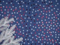White fir-tree branches for Christmas. Colored snowflakes on a blue background. Royalty Free Stock Photo