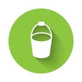 White Fire bucket icon isolated with long shadow. Metal bucket empty or with water for fire fighting. Green circle Royalty Free Stock Photo