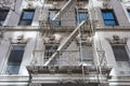 A White Fire Escape on the Side of an Old Beautiful White Building in New York City Royalty Free Stock Photo