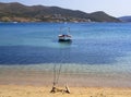 White fishing boat with an awning in the port of the Greek resort town of Marmari on the island of Evia in Greece Royalty Free Stock Photo