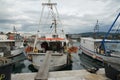 White fishing boat moored in port in town of Koper near the city center.
