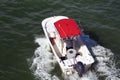 White Fishing Boat with Red Canvas Canopy Royalty Free Stock Photo