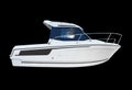 White fishing motor boat isolated on black background. Side view modern fishing boat isolated over black Royalty Free Stock Photo