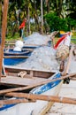 White fishing nets in the blue boat on the beach Royalty Free Stock Photo