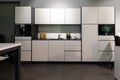 White fitted kitchenette in an open-plan office