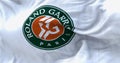 White flag with Roland Garros logo waving in the wind