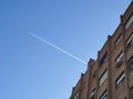 The white flash of the plane appearing through the building causing the lines to be cut, in Madrid