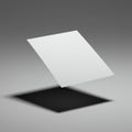 A white, flat quadrilateral object hovers against a gradient gray background, casting a Royalty Free Stock Photo