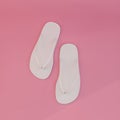 white flip flops isolated on pink background Royalty Free Stock Photo