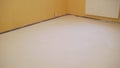 White floors that the worker did. Floor made with mortar. empty white room interior in residential house building with tile Royalty Free Stock Photo