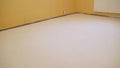 White floors that the worker did. Floor made with mortar. empty white room interior in residential house building with tile Royalty Free Stock Photo