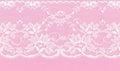 White floral lace on a pink background Royalty Free Stock Photo