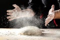 White flour flying into air as pastry chef in white suit slams ball dough on white powder covered table. concept of nature, Italy Royalty Free Stock Photo