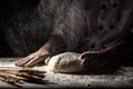 White flour flying into air as pastry chef in white suit slams ball dough on white powder covered table. concept of nature, Italy Royalty Free Stock Photo