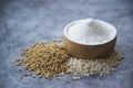 White flour Thai in wooden bowl with white rice Thai and rice ears isolated on tone background, Food and baking ingredient Royalty Free Stock Photo