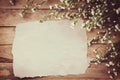 White flower on grunge wood board and paper background with space. Royalty Free Stock Photo