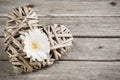 White flower and wicker decorative heart