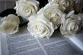 White flowers with a book.