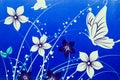 White flowers and butterflies drawn on blue background