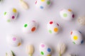 Flowers and dotty eggs on a white background.