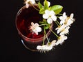 White flowers with a drink in a wine glass Royalty Free Stock Photo