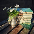 White flowers and Old books Royalty Free Stock Photo