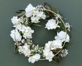 White flowers on round gold frame