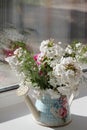 White flowers in a watering can