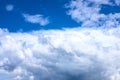 White fluffy cloud on azure blue sky. Rain weather or cyclone formation. Abstract natural photo Royalty Free Stock Photo
