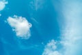 White fluffy clouds against blue sky in summer nature season weather background Royalty Free Stock Photo