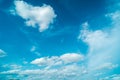 White fluffy clouds against blue sky in summer nature season weather background Royalty Free Stock Photo