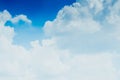 White fluffy clouds against blue sky in summer nature season weather background Royalty Free Stock Photo