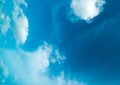 White fluffy clouds against blue sky in summer nature season weather background Royalty Free Stock Photo