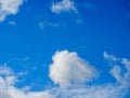 White fluffy clouds against the light blue sky Royalty Free Stock Photo