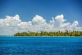 White fluffy clouds blue sky above a caribbean sea surface Royalty Free Stock Photo