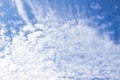 White fluffy clouds in the blue sky abstract background. Royalty Free Stock Photo