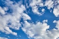 White fluffy clouds on a blue sky background