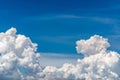 White fluffy clouds on blue sky. Soft touch feeling like cotton. White puffy clouds cape with space for text. Beauty in nature. Royalty Free Stock Photo