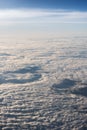 White, fluffy clouds in blue sky. Stratosphere.