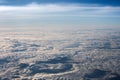 White, fluffy clouds in blue sky. Stratosphere. View from above. Royalty Free Stock Photo