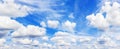 White fluffy clouds clear blue sky background panorama, cumulus cloud texture, cloudy azure skies backdrop, beautiful cloudscape Royalty Free Stock Photo