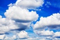 White fluffy clouds on clear sunny blue sky background closeup, cumulus cloud texture, cloudy skies, cloudiness, cloudscape heaven Royalty Free Stock Photo