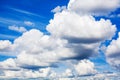 White fluffy clouds on clear sunny blue sky background closeup, cumulus cloud texture, cloudy skies, cloudiness, cloudscape heaven Royalty Free Stock Photo