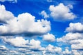 White fluffy clouds on clear sunny blue sky background closeup, cumulus cloud texture, cloudy skies, cloudiness, cloudscape heaven Royalty Free Stock Photo