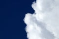 White fluffy clouds on a dark blue sky Royalty Free Stock Photo