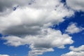 White fluffy clouds in a dark blue sky