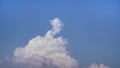 White fluffy clouds open for fantasy idea shape against bright blue sky for background with copy space, graphic resource, cloud Royalty Free Stock Photo