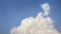 White fluffy clouds open for fantasy idea shape against bright blue sky for background with copy space, graphic resource, cloud Royalty Free Stock Photo