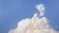 White fluffy clouds open for fantasy idea shape against bright blue sky for background with copy space, graphic resource, cloud Royalty Free Stock Photo